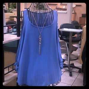 Light blue blouse with necklace